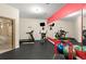 Well-equipped home gym with treadmill, elliptical, weights, and mirrored wall for motivation at 4105 Cougar Ne Pt, Marietta, GA 30066