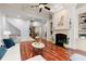 Comfortable living room with fireplace, hardwood floors, coffered ceilings, and staircase at 4105 Cougar Ne Pt, Marietta, GA 30066