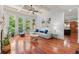 Spacious living room with coffered ceiling, large windows, hardwood floors, and access to the kitchen at 4105 Cougar Ne Pt, Marietta, GA 30066