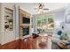 Cozy living room with stone fireplace, built-in shelving, and backyard view at 4105 Cougar Ne Pt, Marietta, GA 30066