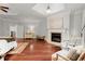 Relaxing main bedroom featuring a fireplace, hardwood floors, and comfortable seating area at 4105 Cougar Ne Pt, Marietta, GA 30066