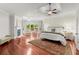 Elegant main bedroom with tray ceiling, fireplace, hardwood floors and large windows at 4105 Cougar Ne Pt, Marietta, GA 30066