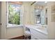 Bathroom vanity area with view of lush greenery at 1011 W Paces Ferry Nw Rd, Atlanta, GA 30327