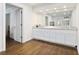 Spacious bathroom with double vanity, granite countertop, and white cabinets at 1011 W Paces Ferry Nw Rd, Atlanta, GA 30327