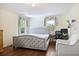 Comfortable bedroom with tufted headboard, desk, and chair for work or relaxation at 1011 W Paces Ferry Nw Rd, Atlanta, GA 30327