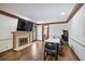 Living room with fireplace, TV, and arcade machine at 1011 W Paces Ferry Nw Rd, Atlanta, GA 30327