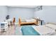 Shared bedroom with blue walls, wood frame beds, and a small study area at 1253 Rivermark Ct, Lawrenceville, GA 30043
