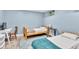 Shared bedroom with blue walls, wood frame beds, and a small study area at 1253 Rivermark Ct, Lawrenceville, GA 30043
