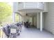 The covered deck has a ceiling fan, grill, and dining set; ideal for gatherings in a peaceful, outdoor setting at 1253 Rivermark Ct, Lawrenceville, GA 30043