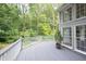 Spacious deck overlooking a private backyard with lush trees at 1253 Rivermark Ct, Lawrenceville, GA 30043