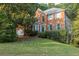 Charming two-story brick home featuring well-maintained landscaping and a welcoming front entrance at 1253 Rivermark Ct, Lawrenceville, GA 30043