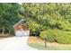 Charming brick home featuring a two-car garage and beautifully landscaped yard at 1253 Rivermark Ct, Lawrenceville, GA 30043