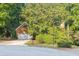 Charming brick home with attached garage and a lush, green front yard at 1253 Rivermark Ct, Lawrenceville, GA 30043
