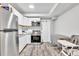 Clean and functional kitchen with white cabinets and stainless steel appliances at 1253 Rivermark Ct, Lawrenceville, GA 30043