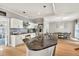 Beautiful kitchen with granite counters, stainless steel appliances, a kitchen island, and a dining area at 1253 Rivermark Ct, Lawrenceville, GA 30043