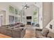 Bright living room with vaulted ceilings, large windows, hardwood floors, and a fireplace at 1253 Rivermark Ct, Lawrenceville, GA 30043