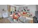Bright living room with hardwood floors, neutral walls, with french doors at 1253 Rivermark Ct, Lawrenceville, GA 30043
