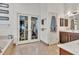 Well lit bathroom featuring double door closet and vanity at 1253 Rivermark Ct, Lawrenceville, GA 30043