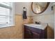 Elegant powder room with a dark wood vanity, granite countertop, and stylish fixtures at 186 Wallnut Hall Cir, Woodstock, GA 30189
