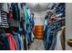 This walk-in closet provides ample space for storage and organization at 186 Wallnut Hall Cir, Woodstock, GA 30189