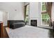 Spacious living room featuring a fireplace, tall windows, and an open concept at 186 Wallnut Hall Cir, Woodstock, GA 30189