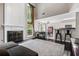 Spacious living room featuring a fireplace, tall windows, and an open concept at 186 Wallnut Hall Cir, Woodstock, GA 30189