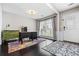 Inviting office with hardwood floors, wainscoting, neutral paint, and a colorful rug at 186 Wallnut Hall Cir, Woodstock, GA 30189