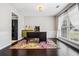 Inviting office with hardwood floors, wainscoting, neutral paint, and a colorful rug at 186 Wallnut Hall Cir, Woodstock, GA 30189