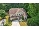Beautiful aerial view of a large two-story home with a two-car garage at 2740 Creekside Manor Dr, Powder Springs, GA 30127