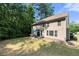 Large backyard with lush grass and a patio area, great for outdoor entertaining at 2740 Creekside Manor Dr, Powder Springs, GA 30127