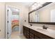 Inviting bathroom with double sinks and shower/tub combo with tiled floors at 2740 Creekside Manor Dr, Powder Springs, GA 30127