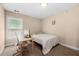 Cozy bedroom with a single bed, desk and chair, and a bright window at 2740 Creekside Manor Dr, Powder Springs, GA 30127