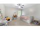 Bright and airy bedroom with stylish wallpaper, and ample sunlight at 2740 Creekside Manor Dr, Powder Springs, GA 30127