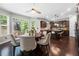 Bright dining area next to the kitchen with large windows offering views of the backyard at 2740 Creekside Manor Dr, Powder Springs, GA 30127