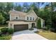 Charming two-story home with a two-car garage and well-manicured landscaping at 2740 Creekside Manor Dr, Powder Springs, GA 30127