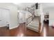 Inviting foyer with hardwood floors, staircase, and neutral wall paint at 2740 Creekside Manor Dr, Powder Springs, GA 30127