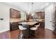 Kitchen with an island, granite countertops, stainless steel appliances, and dark wood cabinets at 2740 Creekside Manor Dr, Powder Springs, GA 30127