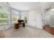 Bright office features a desk, a basketball hoop, and large windows at 2740 Creekside Manor Dr, Powder Springs, GA 30127