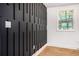 A captivating accent wall complements the hardwood flooring and natural light filtering through the windows at 904 Fairburn Nw Pl, Atlanta, GA 30331