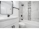 Modern bathroom with white marble tile, black fixtures, and built in shower niche at 904 Fairburn Nw Pl, Atlanta, GA 30331