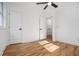 Well-lit bedroom boasts hardwood floors and white doors and trim at 904 Fairburn Nw Pl, Atlanta, GA 30331