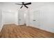 Spacious, well-lit bedroom with rich hardwood floors, classic white trim, and convenient double closet at 904 Fairburn Nw Pl, Atlanta, GA 30331