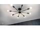 Modern chandelier with exposed bulbs illuminates a room with stylish flair and energy-efficient lighting at 904 Fairburn Nw Pl, Atlanta, GA 30331