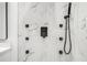 Spa-like shower features elegant white tile walls and modern black shower fixtures at 904 Fairburn Nw Pl, Atlanta, GA 30331