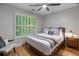 Serene bedroom with hardwood floors, a ceiling fan, and plantation shutters at 1251 Brickton Nw Dr, Atlanta, GA 30318