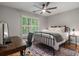 Comfortable bedroom with hardwood floors, a ceiling fan, and natural light at 1251 Brickton Nw Dr, Atlanta, GA 30318