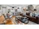 Cozy living room with a breakfast bar, an open staircase, and hardwood floors at 1251 Brickton Nw Dr, Atlanta, GA 30318