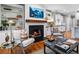 Inviting living room with a fireplace, built-in shelving, and natural light at 1251 Brickton Nw Dr, Atlanta, GA 30318