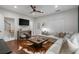 Cozy living room with wood floors, a neutral couch, and easy access to the staircase at 1251 Brickton Nw Dr, Atlanta, GA 30318