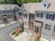 Aerial view of townhomes with well-maintained landscaping and private garages at 1251 Brickton Nw Dr, Atlanta, GA 30318